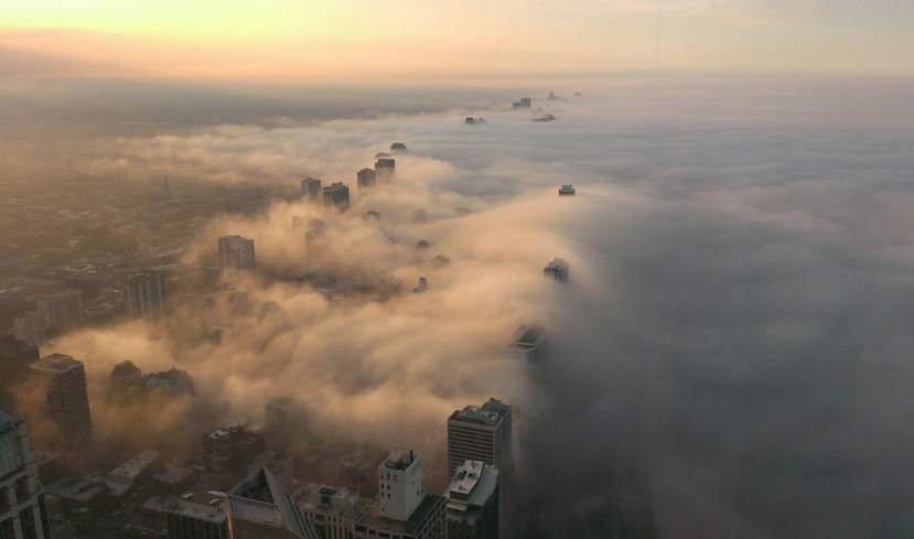 This picture was taken from the top of the John Hancock building - 97 stories up - in Chicago, Illinois as fog rolled in from Lake Michigan - Bob Gaudet